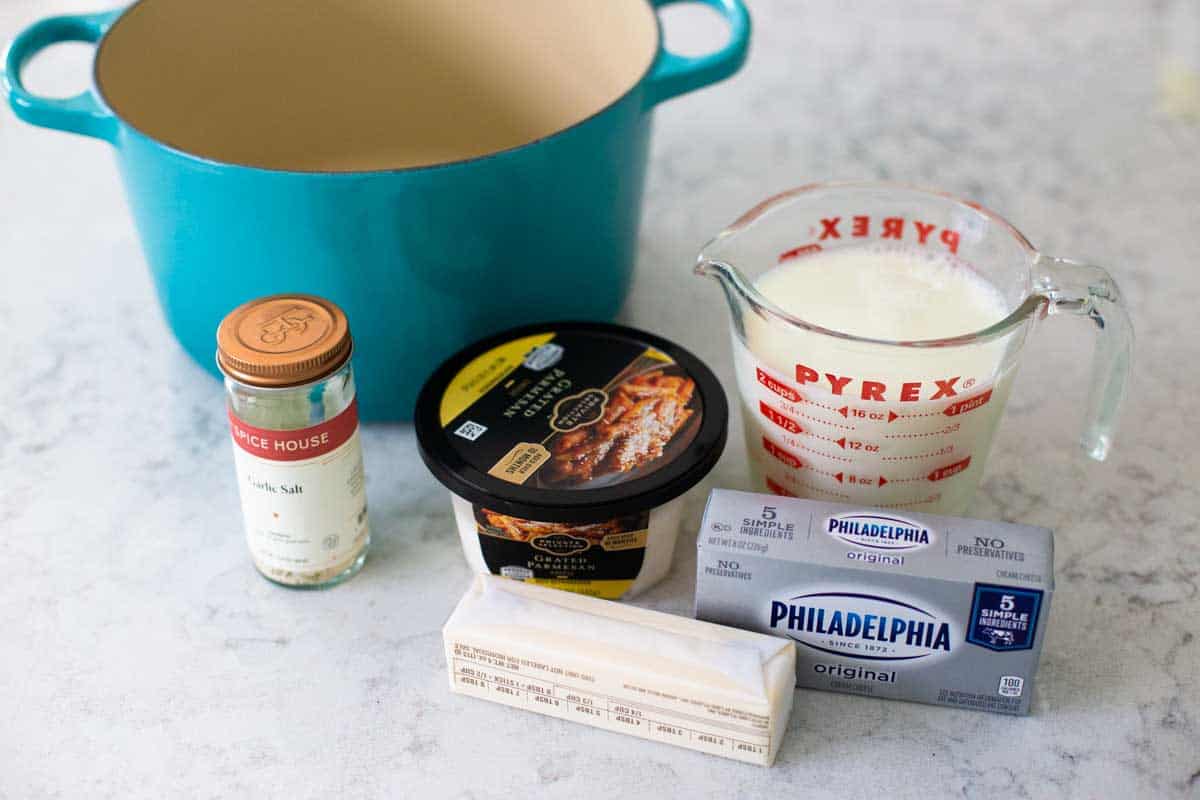 The ingredients for the homemade alfredo sauce is on the counter.