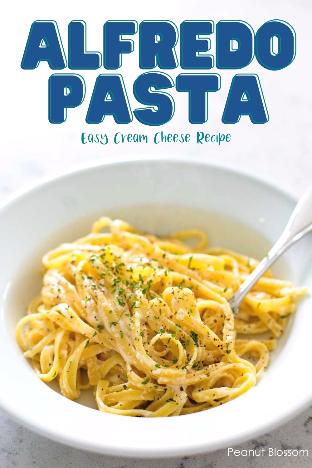 The finished bowl of pasta coated in Alfredo sauce has parsley sprinkled over the top.