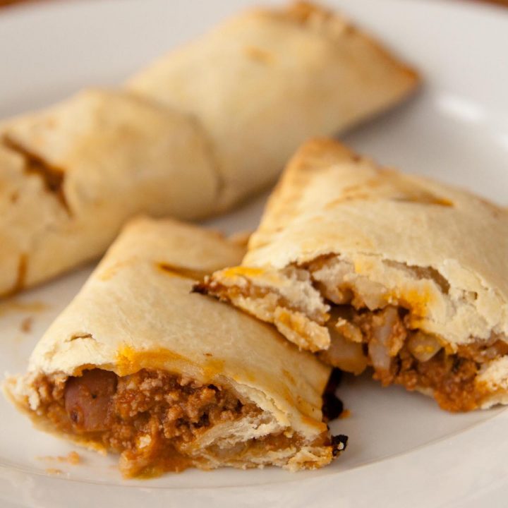 An Irish beef handpie has been cut in half so you can see the ground beef filling.