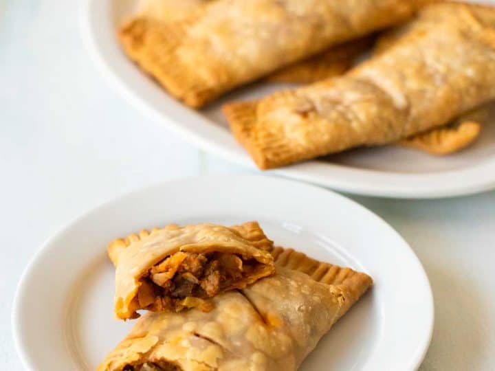 A serving of Irish Beef Hand Pies on a white platter.
