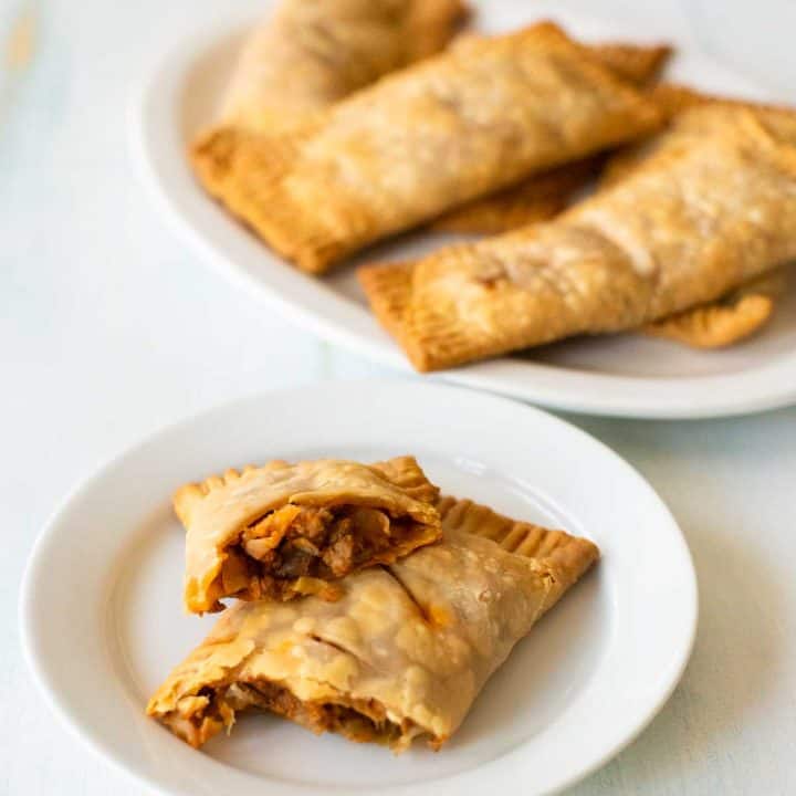 A serving of Irish Beef Hand Pies on a white platter.