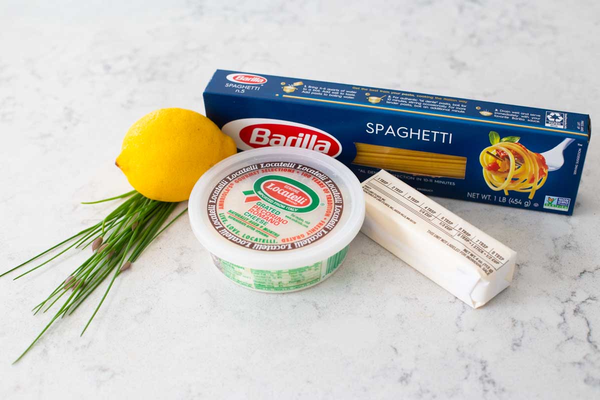 The ingredients for a simple pasta dish are on the counter.