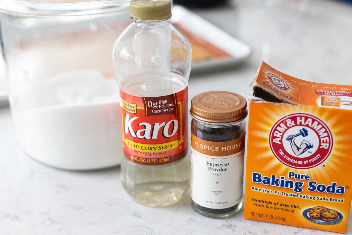 The ingredients to make the crunchy candy topping for the cake is on the counter.