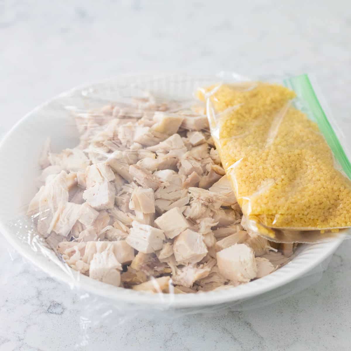 The chicken and pasta have been stored separately from the soup base.