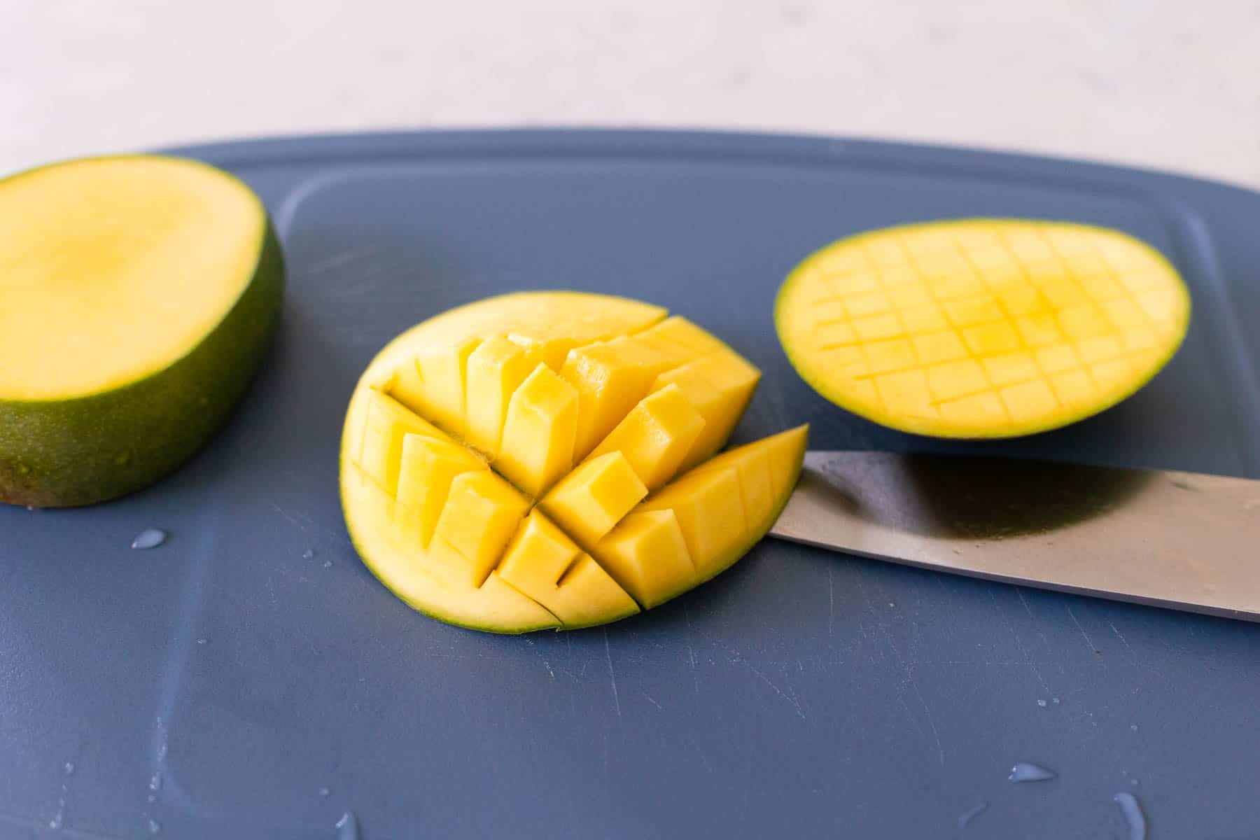 The fresh mango has been pressed outwards so the scored fruit pops up.