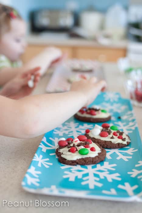 Interactive chocolate peppermint bark cookies are so fun to bake with kids. Let them customize each one with their favorite candy toppings.