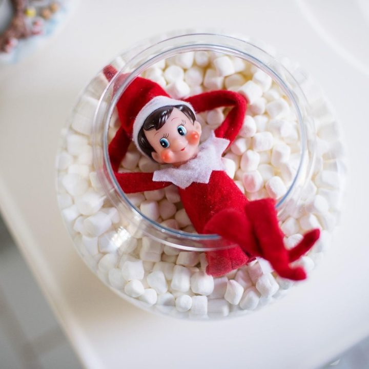 An Elf on the Shelf is taking a bath in marshmallows