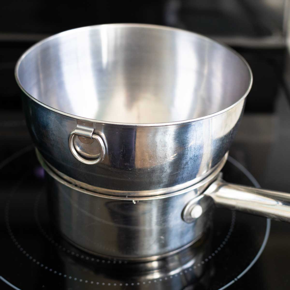 A double boiler has been made out of a regular kitchen saucepan and mixing bowl.