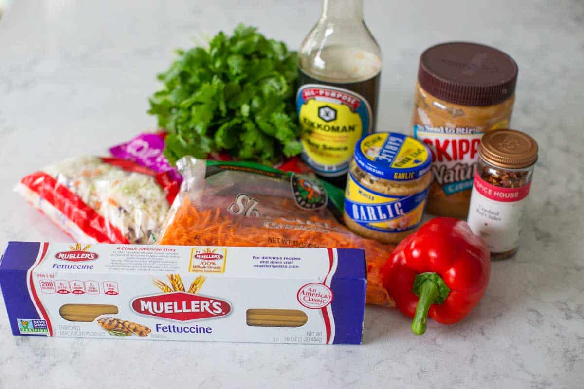 Ingredients for the Asian peanut butter pasta are on the counter.