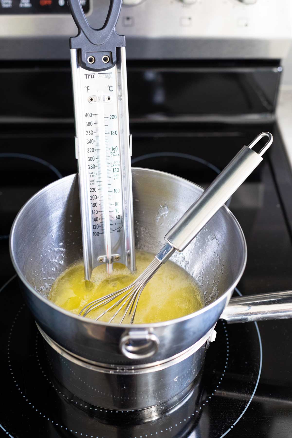 The double boiler has a candy thermometer so the egg whites can be whisked to 160°F.