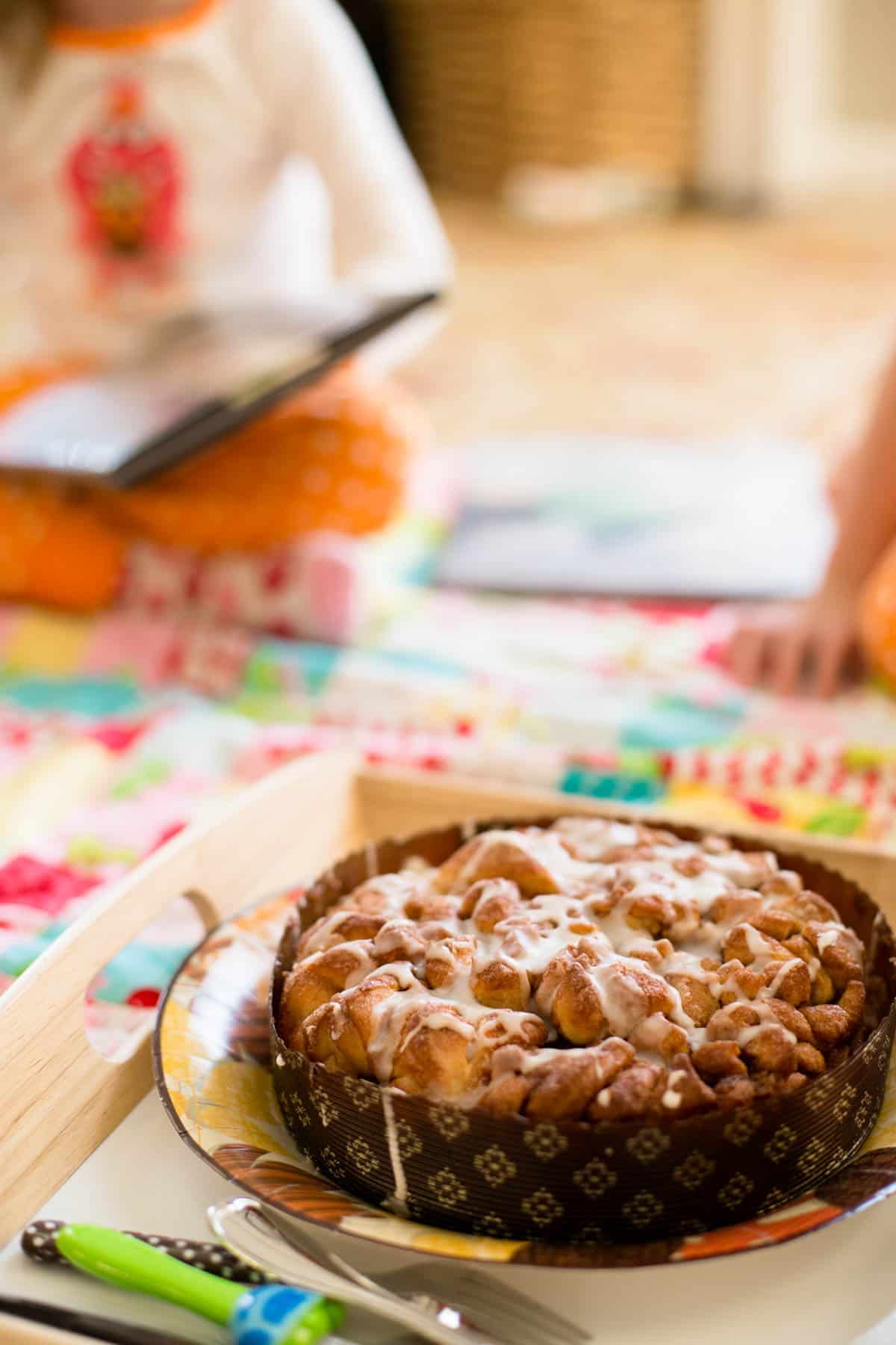 The coffee cake is on a tray on the living room floor so it can be eaten picnic style.