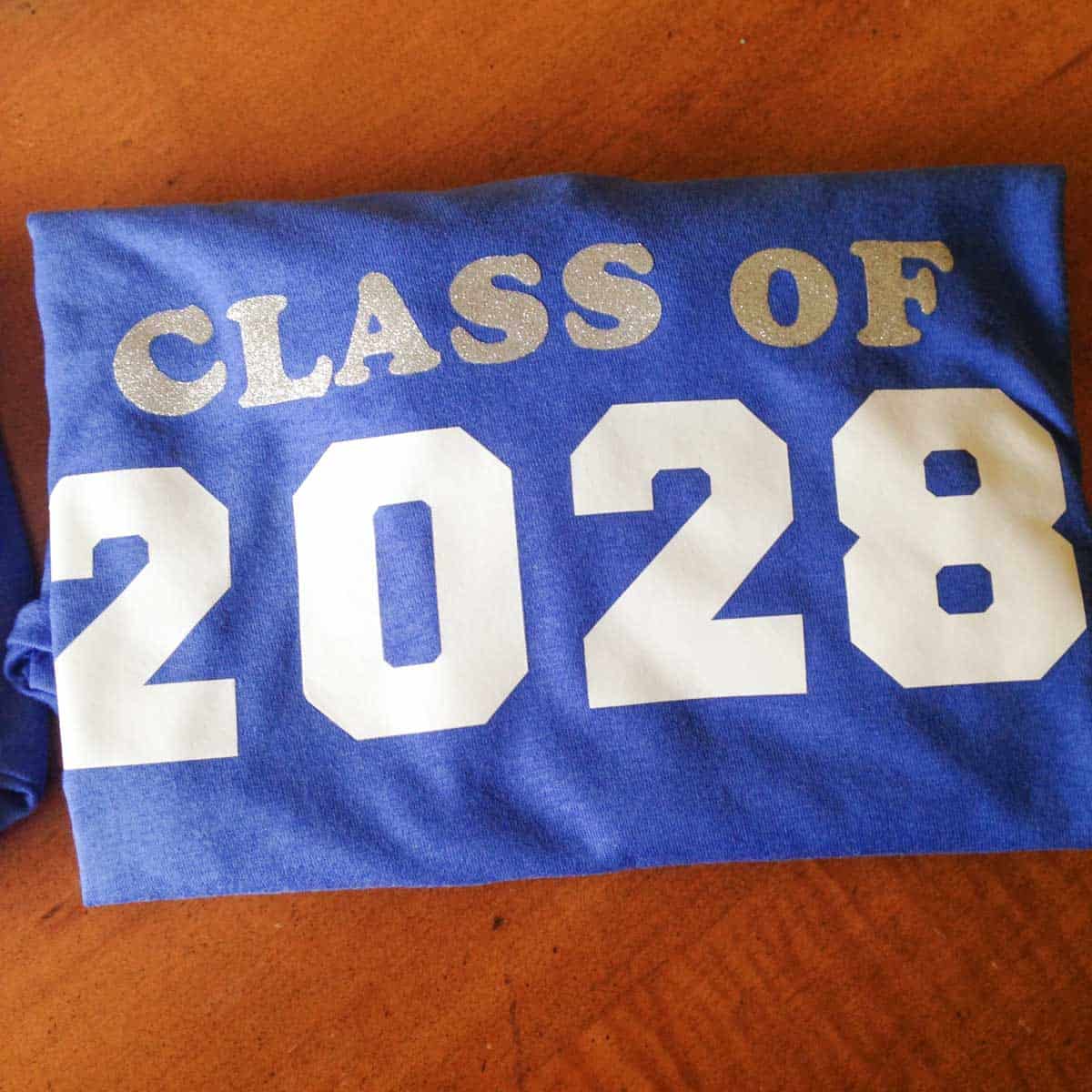 A class t-shirt says "Class of 2028"