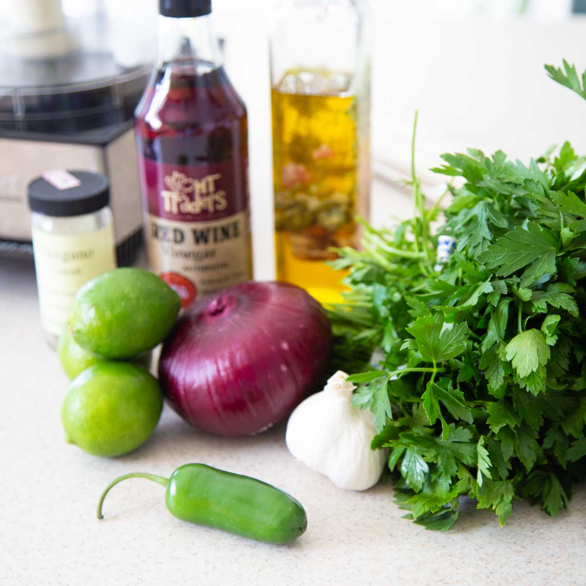 The ingredients to make the chimichurri sauce for the flank steak are on the counter.