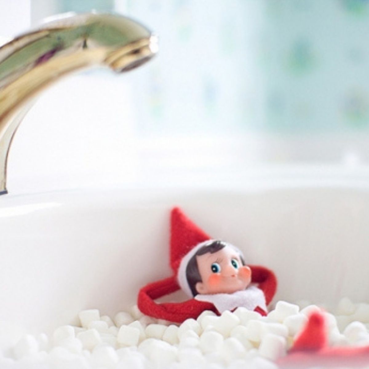 The Elf on the Shelf is soaking in a sink full of mini marshmallows.
