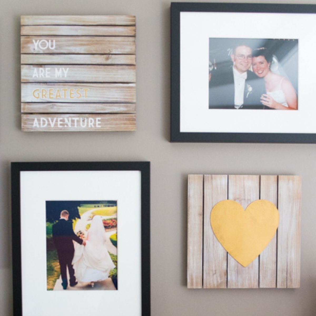 Wedding photos and wooden art featuring romantic quotes and a golden heart.