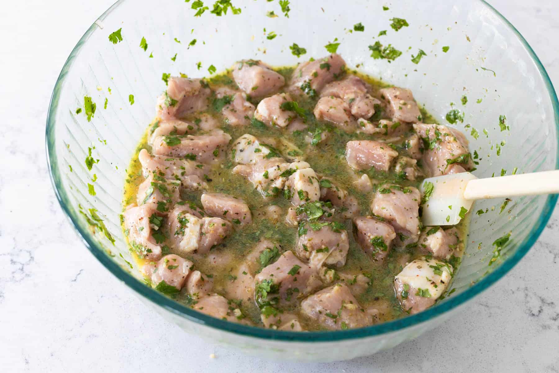 Chopped chicken breast is now marinating in the cuban mojo marinade.