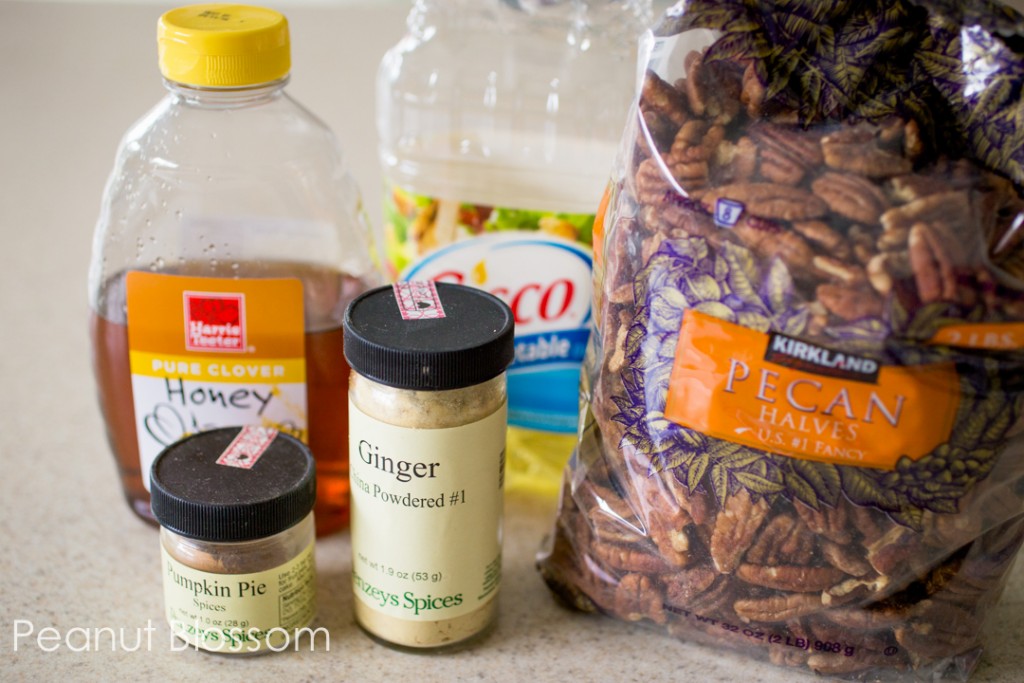 The ingredients to make pumpkin spice pecans are on the counter.
