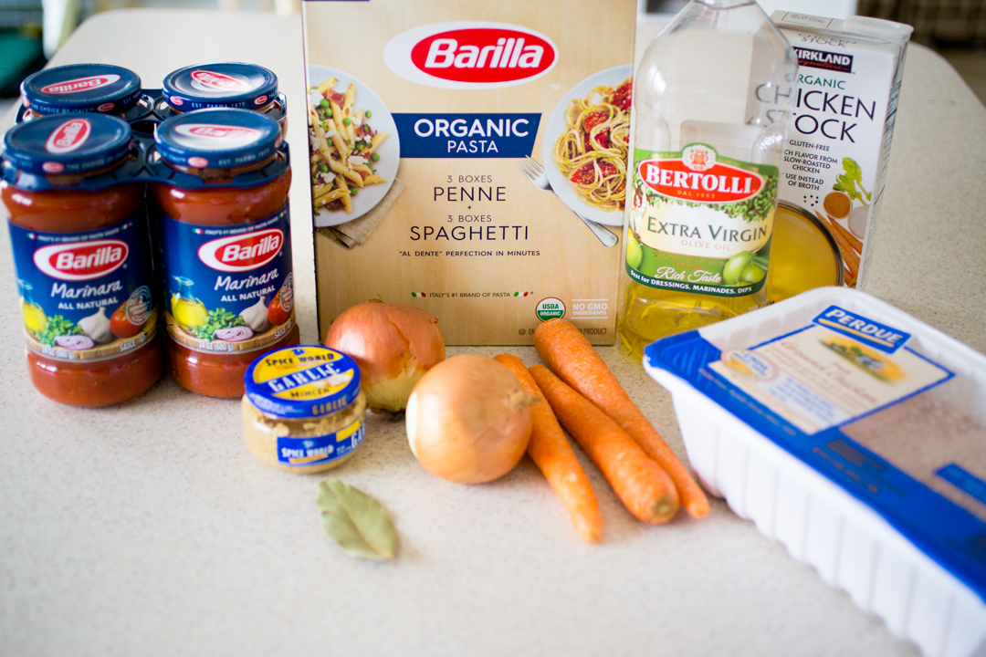 The ingredients to make chicken bolognese are on the kitchen counter.