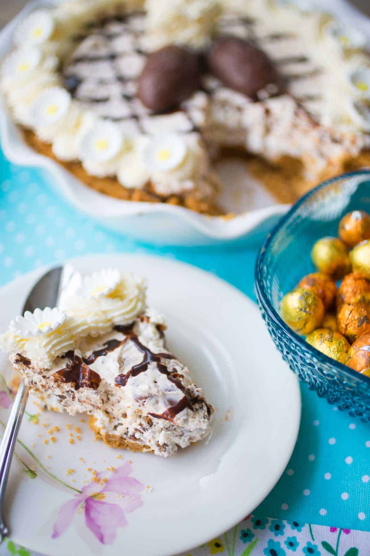 The slice of pie is on a flowered plate. 