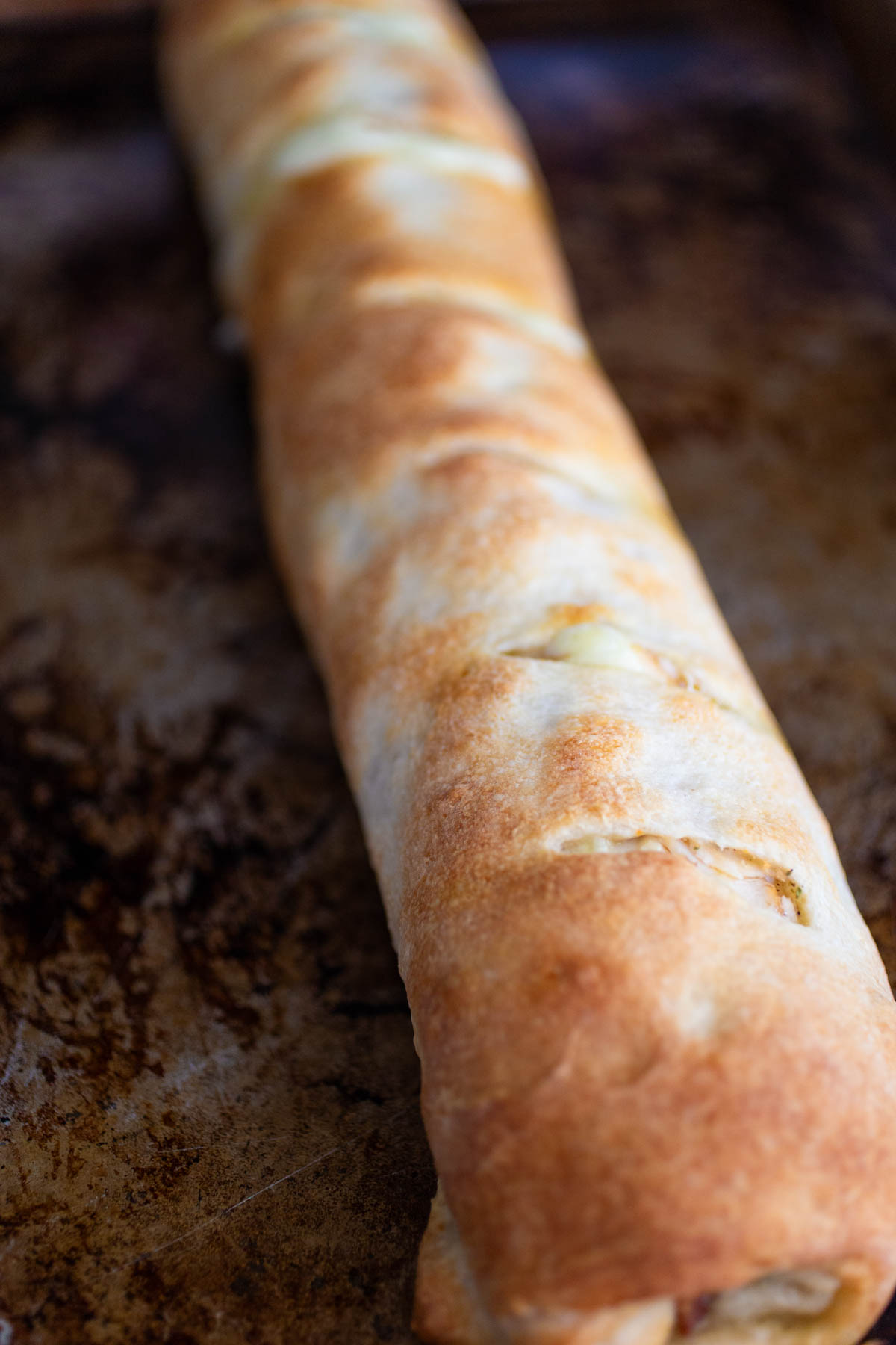 The rolled dough has been baked and is now a golden brown.