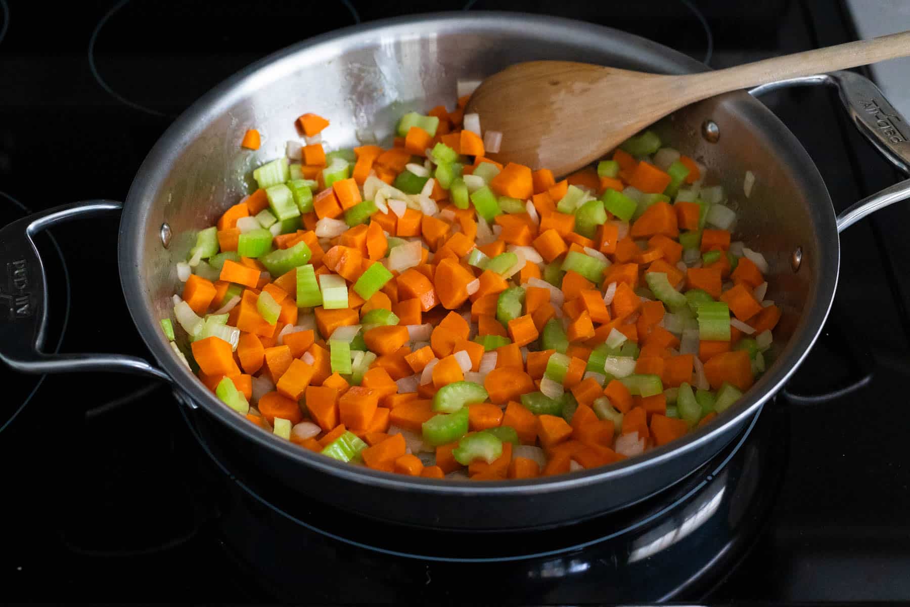 The veggies have been cooked in a saute pan until the onions are translucent.