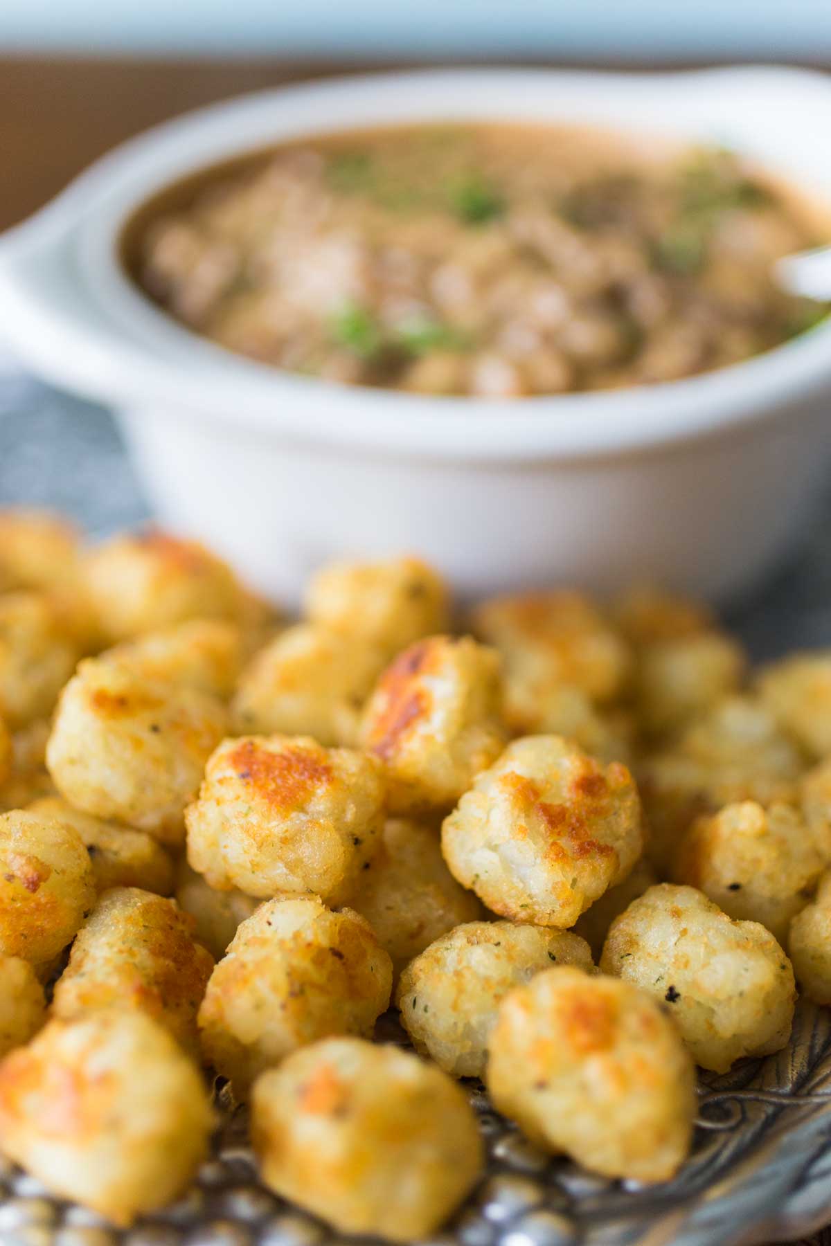 The close up photo of the tater tots shows the golden brown crunch.