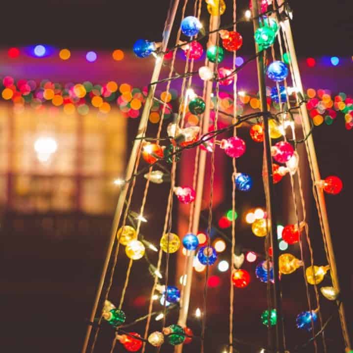 A Christmas light display at night in front of the family home.