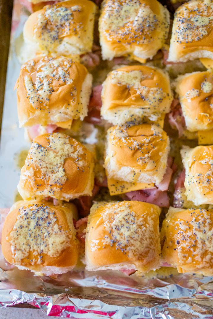 Buttery delicious Hawaiian roll ham and cheese sliders are the perfect party food for feeding a large crowd.