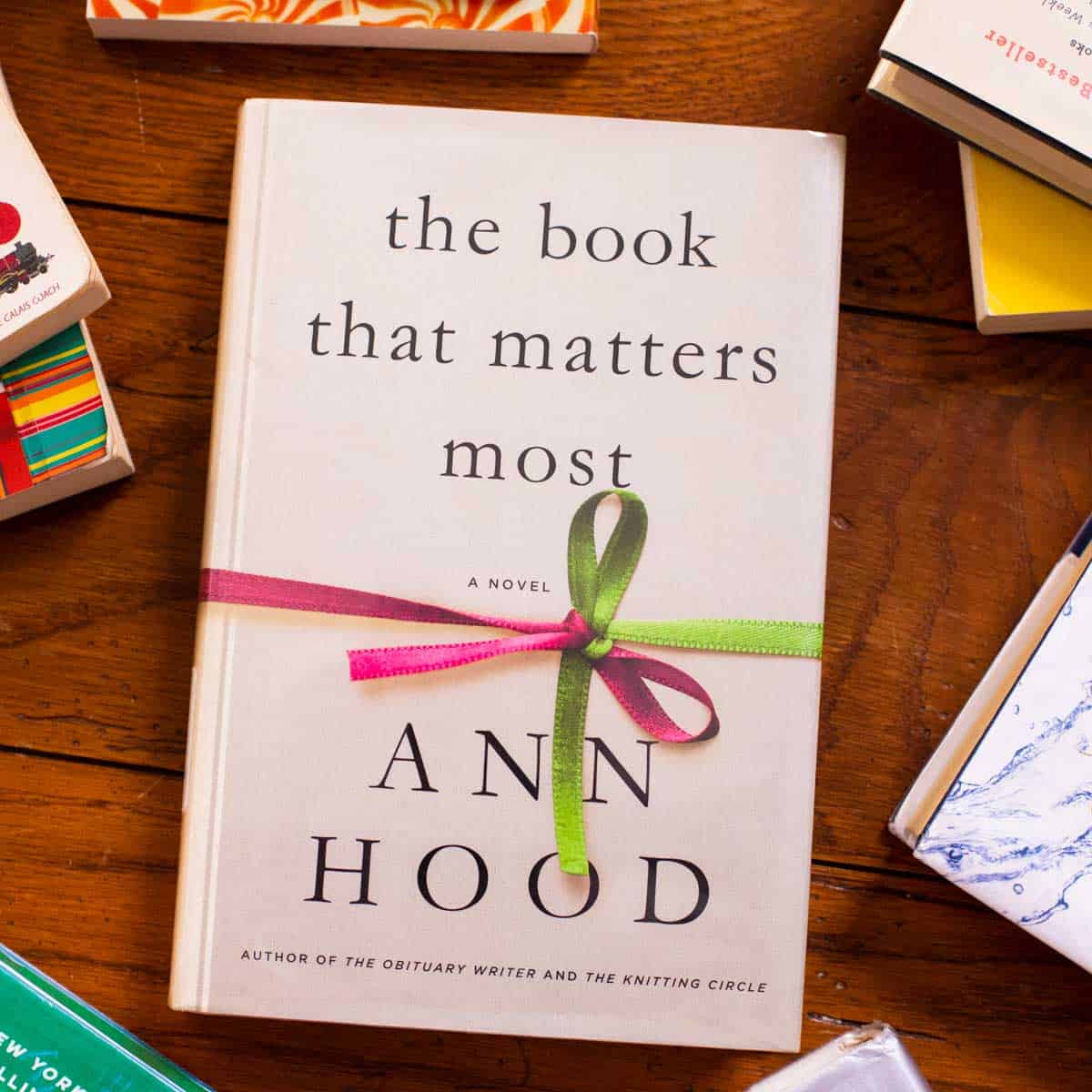 A copy of The Book That Matters Most by Ann Hood sits on a table.