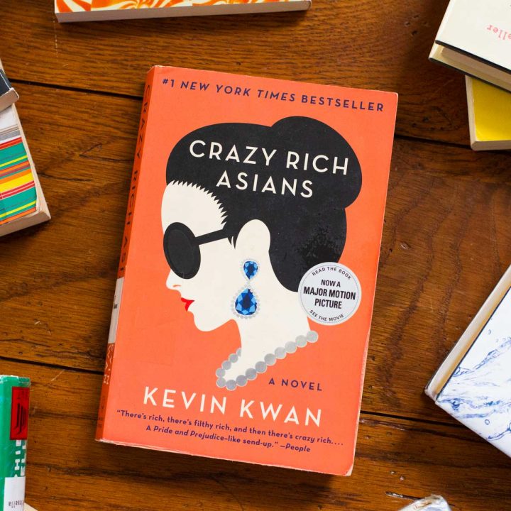 A copy of Crazy Rich Asians sits on a table.