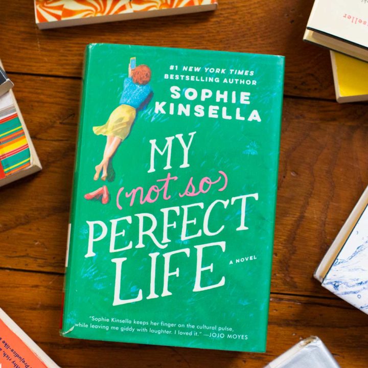 A copy of My Not So Perfect Life by Sophie Kinsella sits on a table