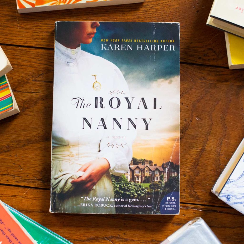 A copy of The Royal Nanny sits on a table.