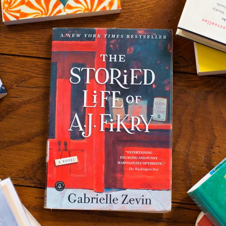 A copy of The Storied Life of AJ Fikry sits on a table.
