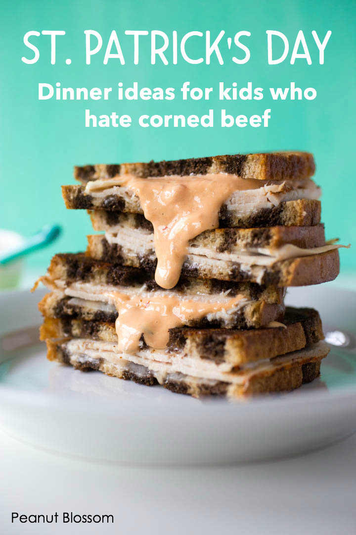 A turkey reuben has thousand island dressing dribbling down the side. The caption on the photo reads: St. Patrick's Day Dinner ideas for kids who hate corned beef.