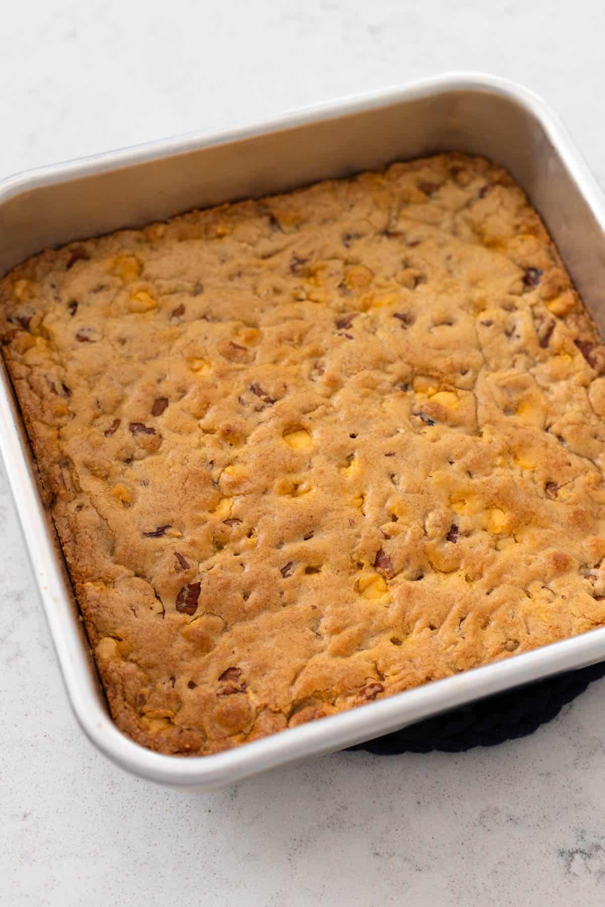 The finished pan of butterscotch bars are fresh from the oven and a pretty golden brown color.