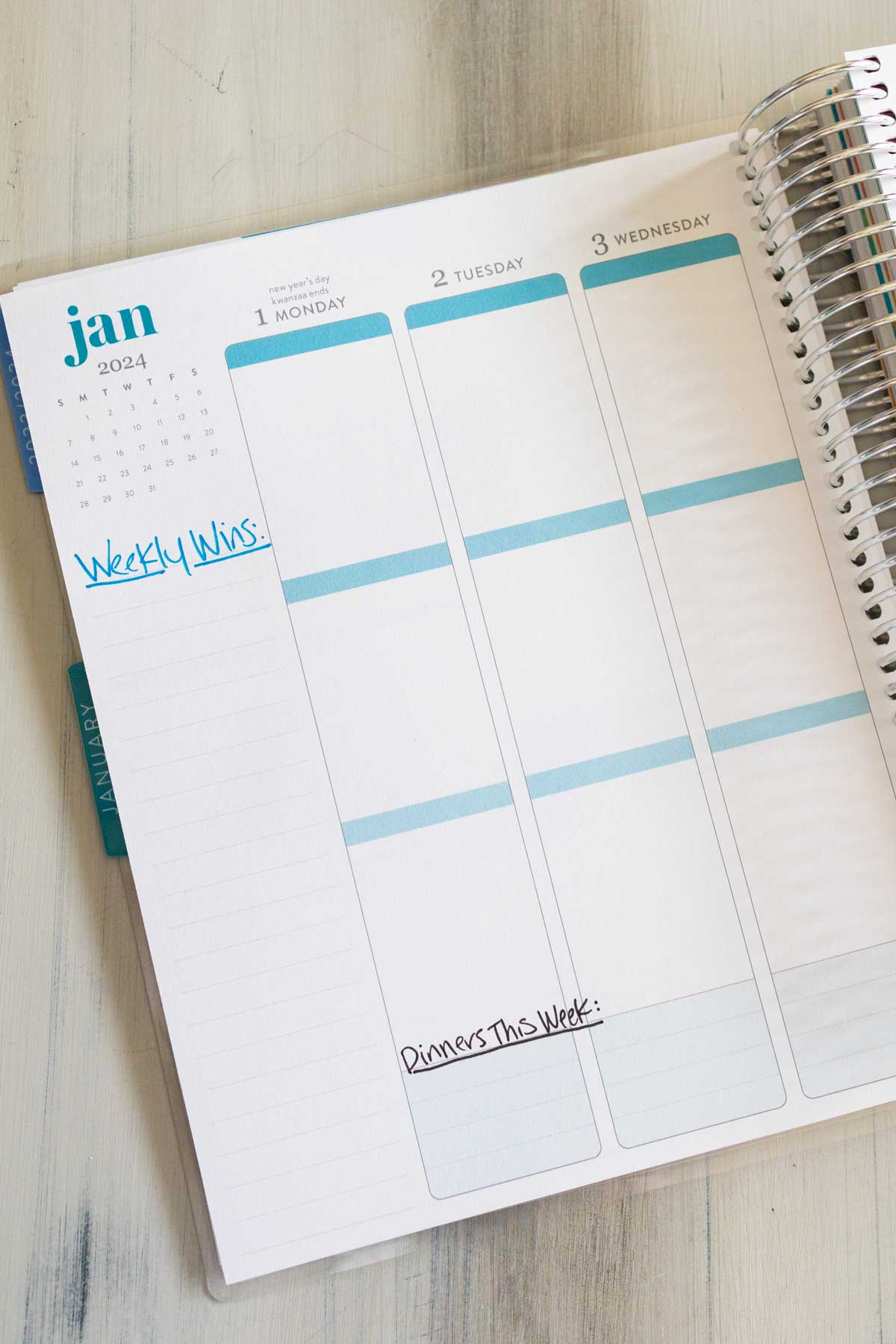 The planner is open so you can see the weekly planning page design layout.