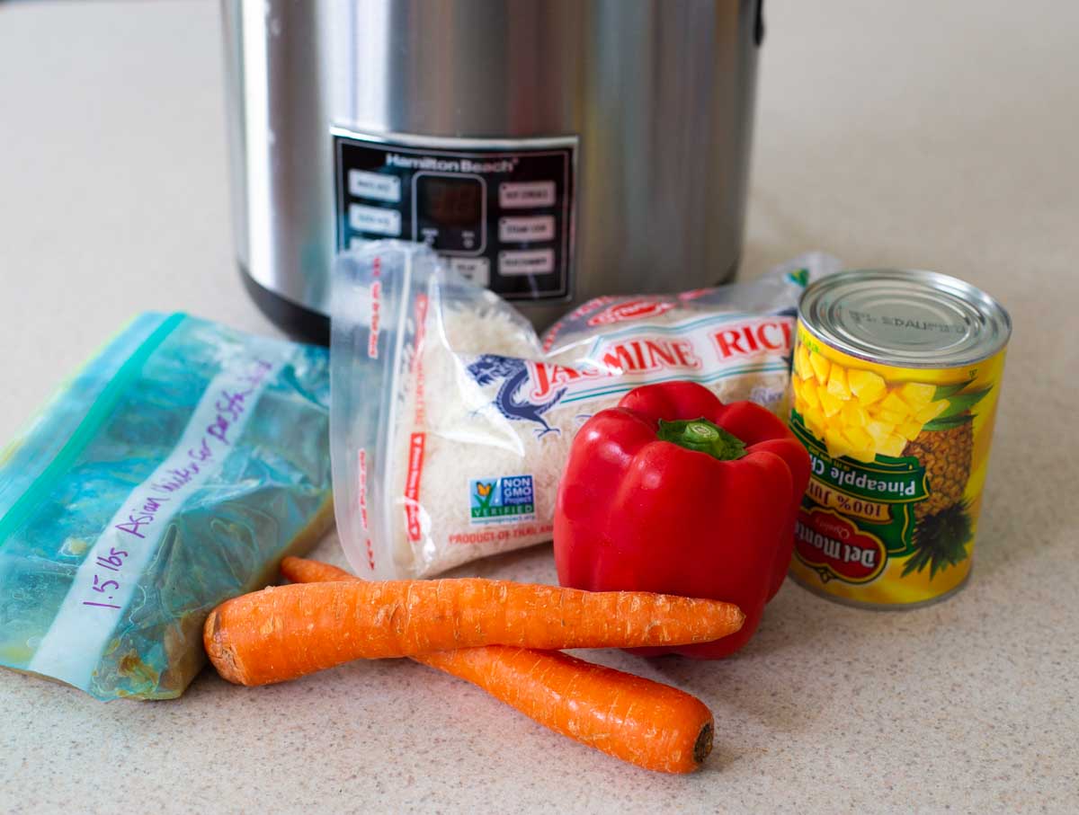 Ingredients for the Instant Pot Asian Chicken and Rice are on the counter.