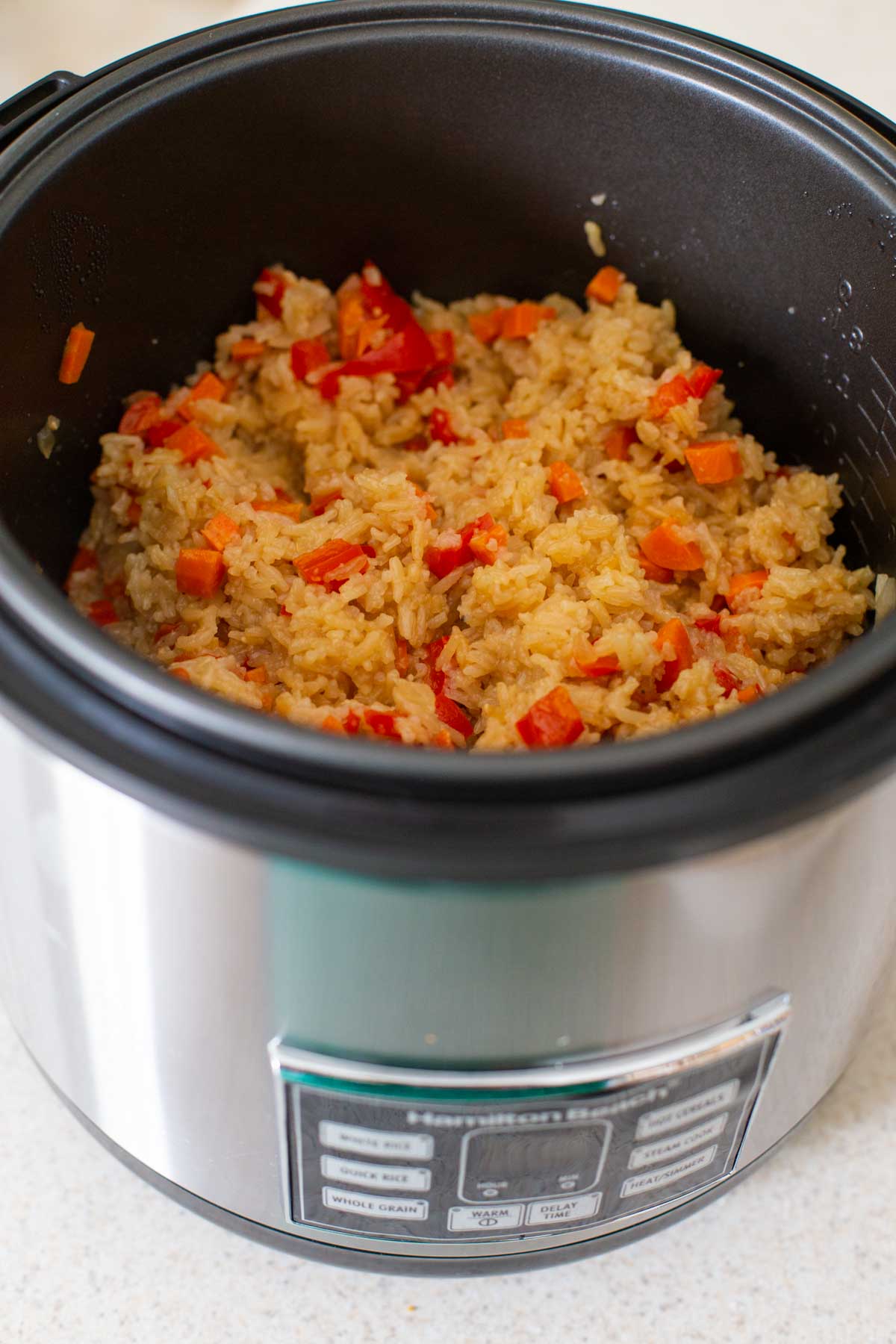 The finished rice with veggies is shown in the Instant Pot pot.