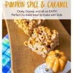 A few squares of Cheerios bars on a tray with a pumpkin decoration.