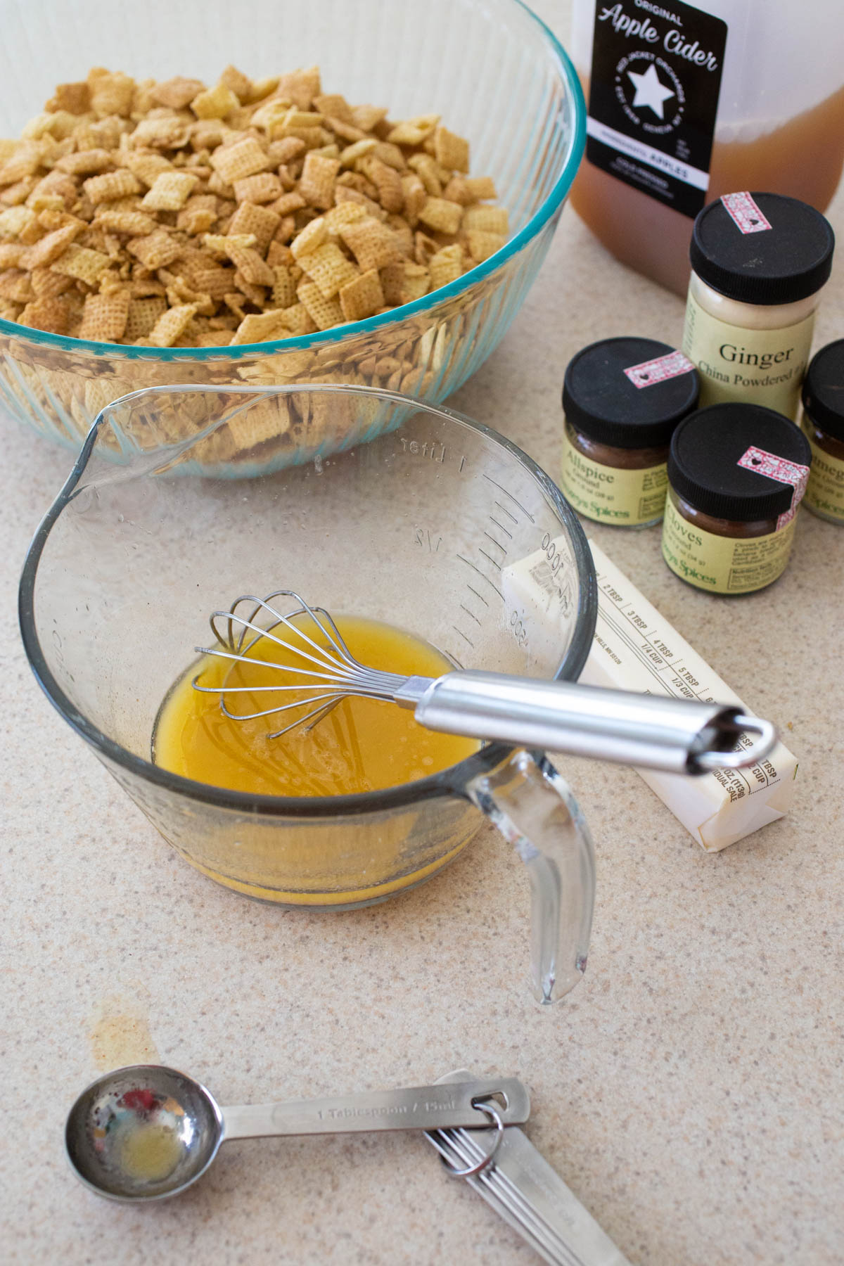 The melted butter and apple cider have been whisked together with apple pie seasonings.