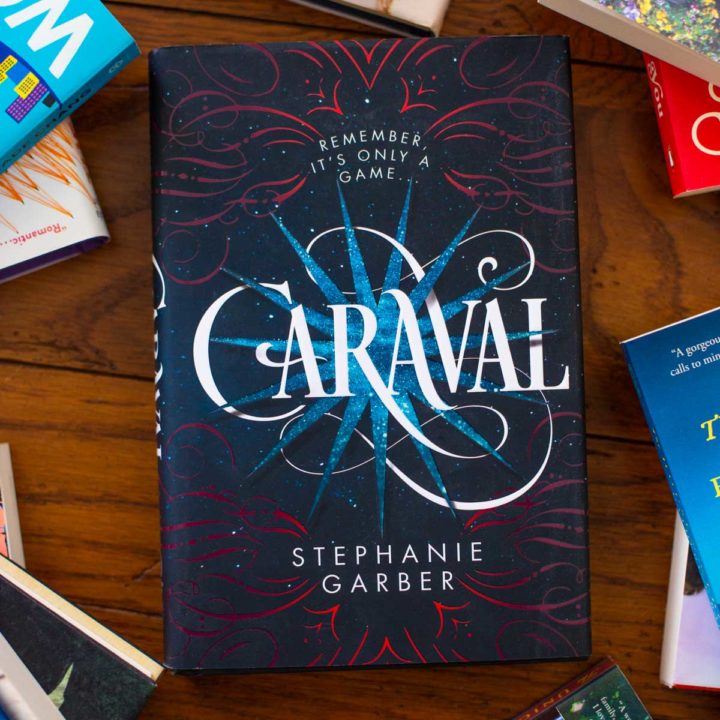 A copy of Caraval sits on a table.