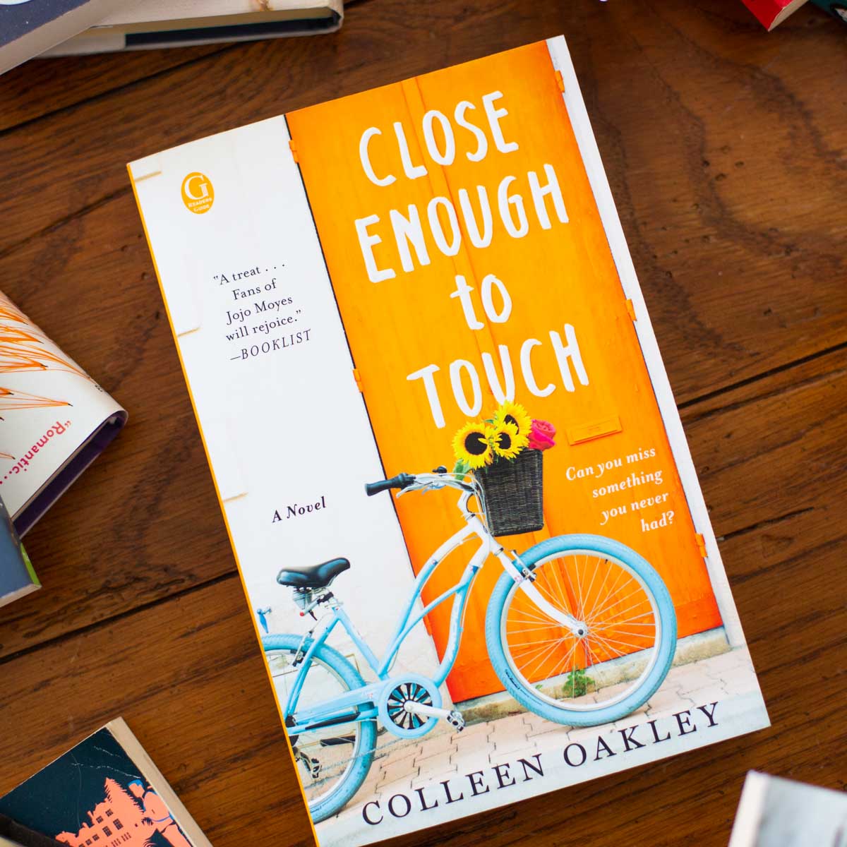 A copy of Close Enough to Touch sits on a table.