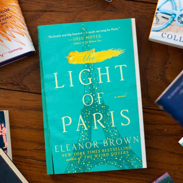 A copy of The Light of Paris sits on a table.