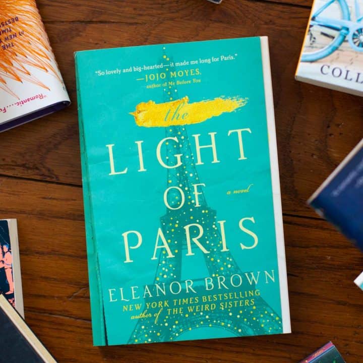 A copy of The Light of Paris sits on a table.