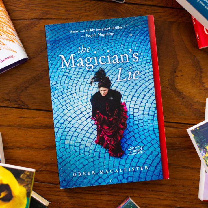 A copy of The Magician's Lie sits on a table.