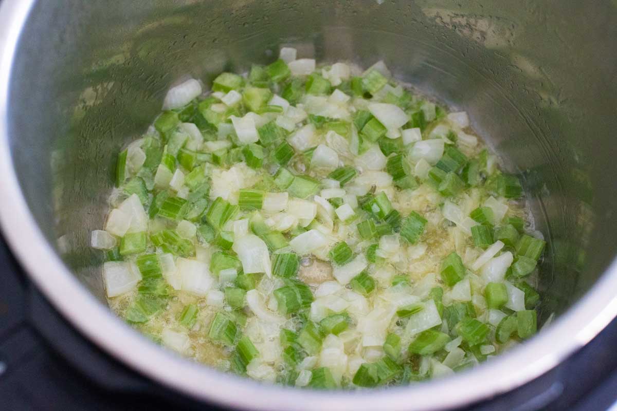 The saute function is used to cook the celery and onions which are just now beginning to soften.
