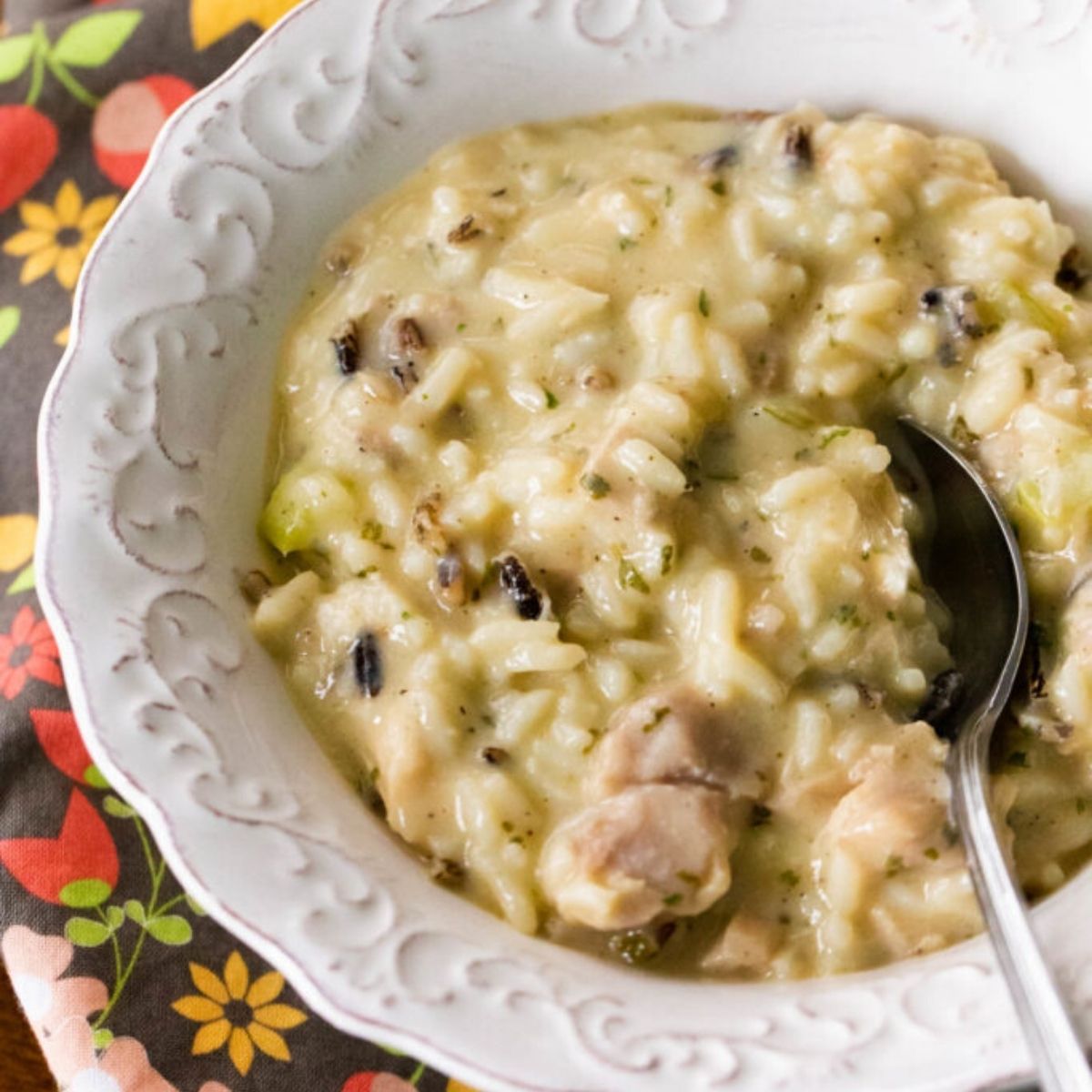 A bowl of thick and creamy chicken wild rice soup.