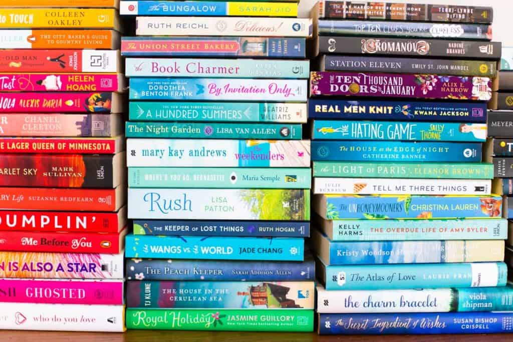 Colorful stacks of fiction books in a row.