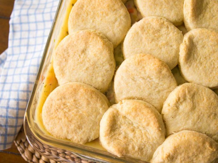 A baking pan filled with ham pot pie filling and topped with fresh homemade biscuits instead of pie crust.