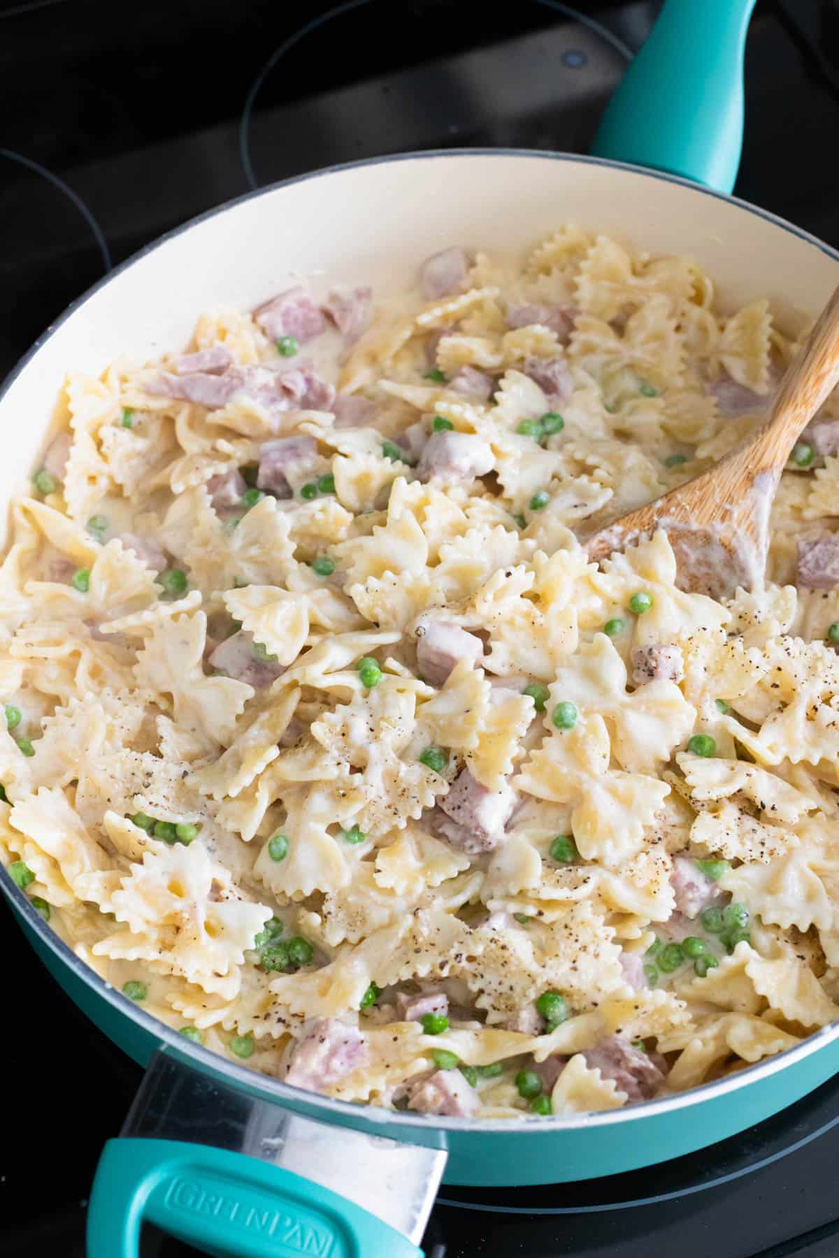 The finished pasta dish is in a large skillet and ready to serve.